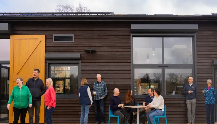 People standing and chatting outside the Sevenoaks Visitor Centre.