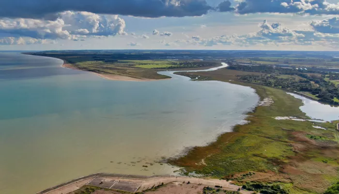 A photo of Pegwell Bay from above, showing the stretch of land and the sea.