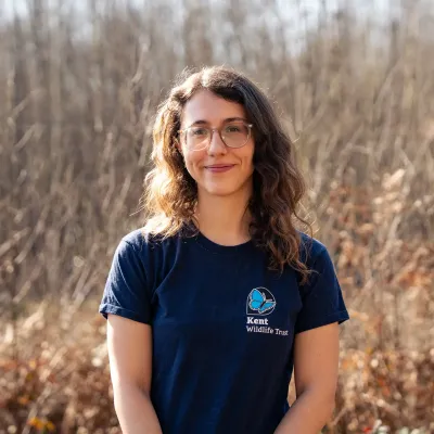 Heidi Aguirregoicoa stood in front of the woods. One of the bison rangers for Kent Wildlife Trust/ 